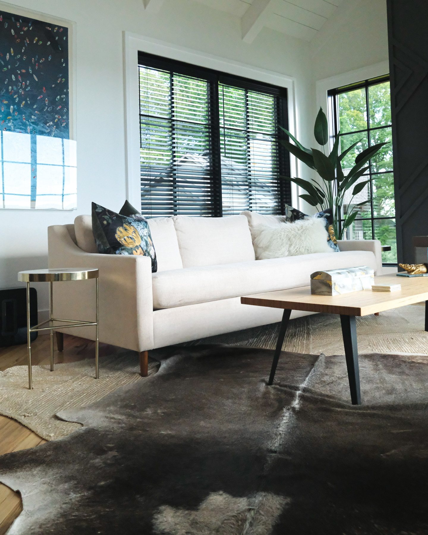 Sway in a client's living room — natural linen, walnut legs